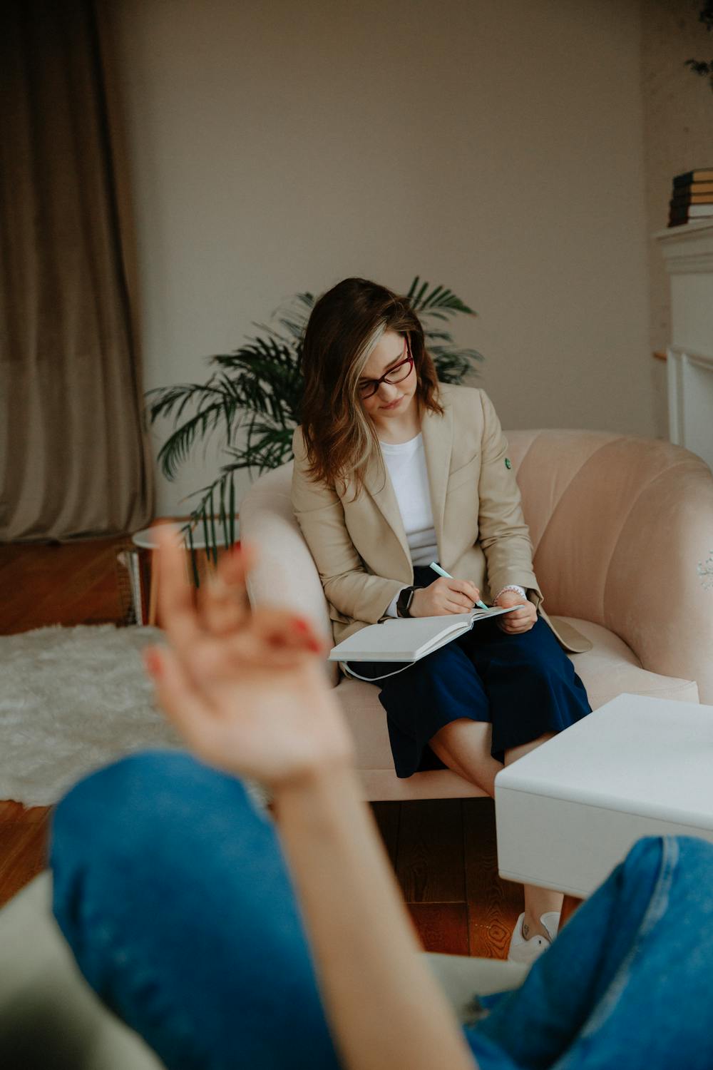 EMDR therapist taking notes during a session